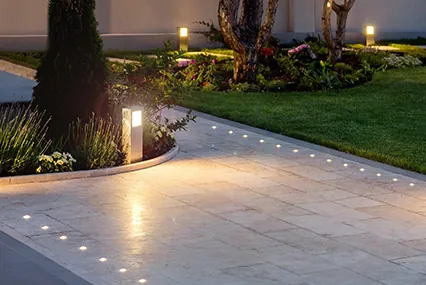 Landscape lighting along a stone pathway
